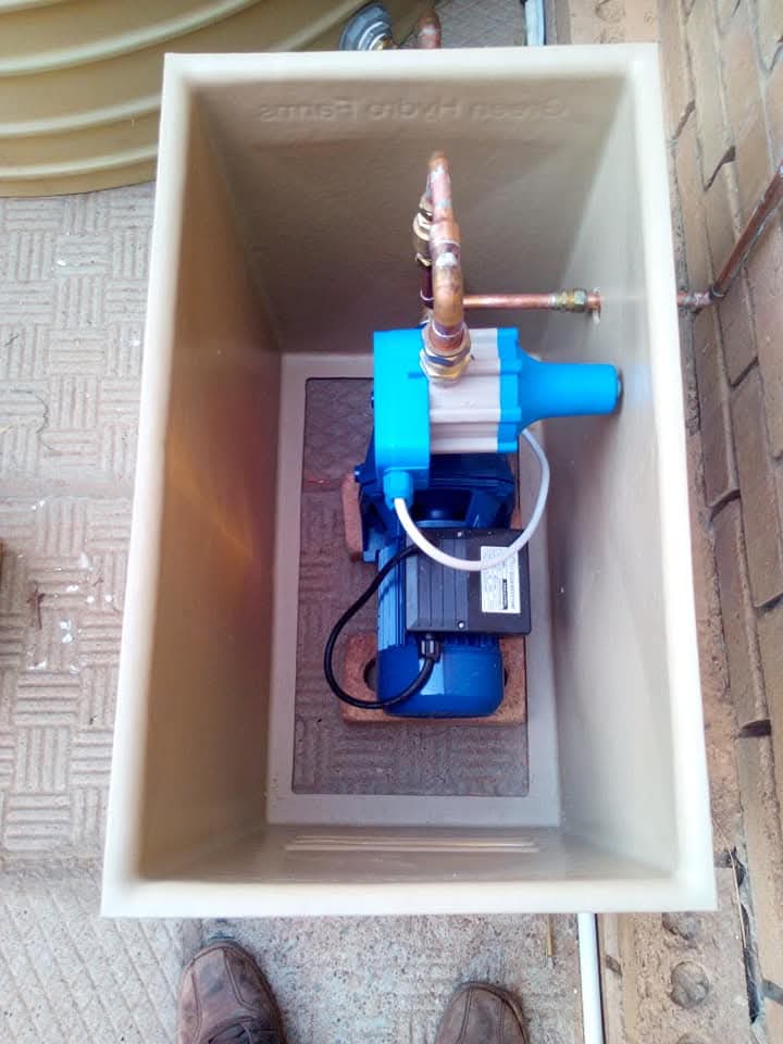 Booster pump installed in a protective box