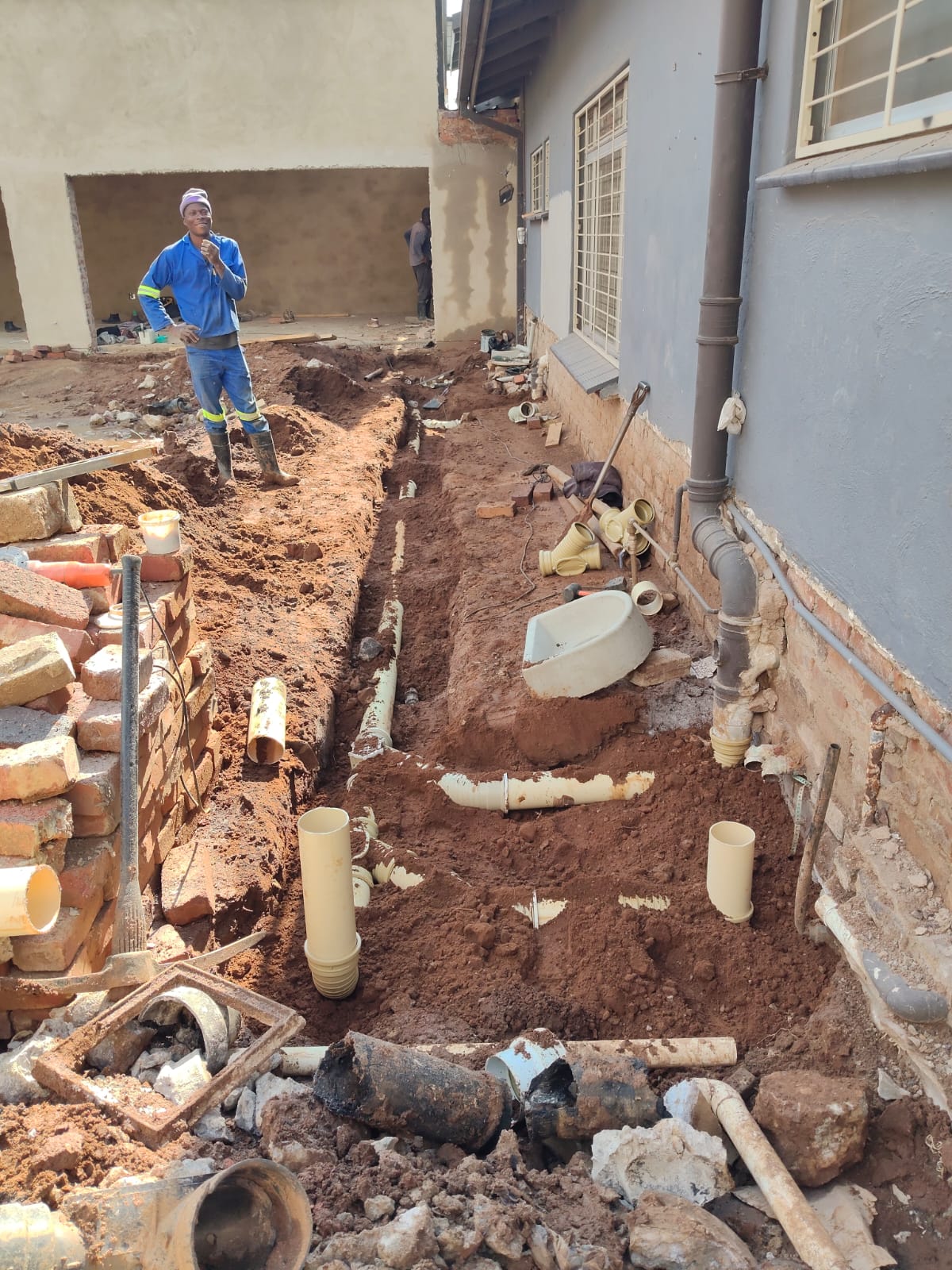New PVC drain lines laid in a trench